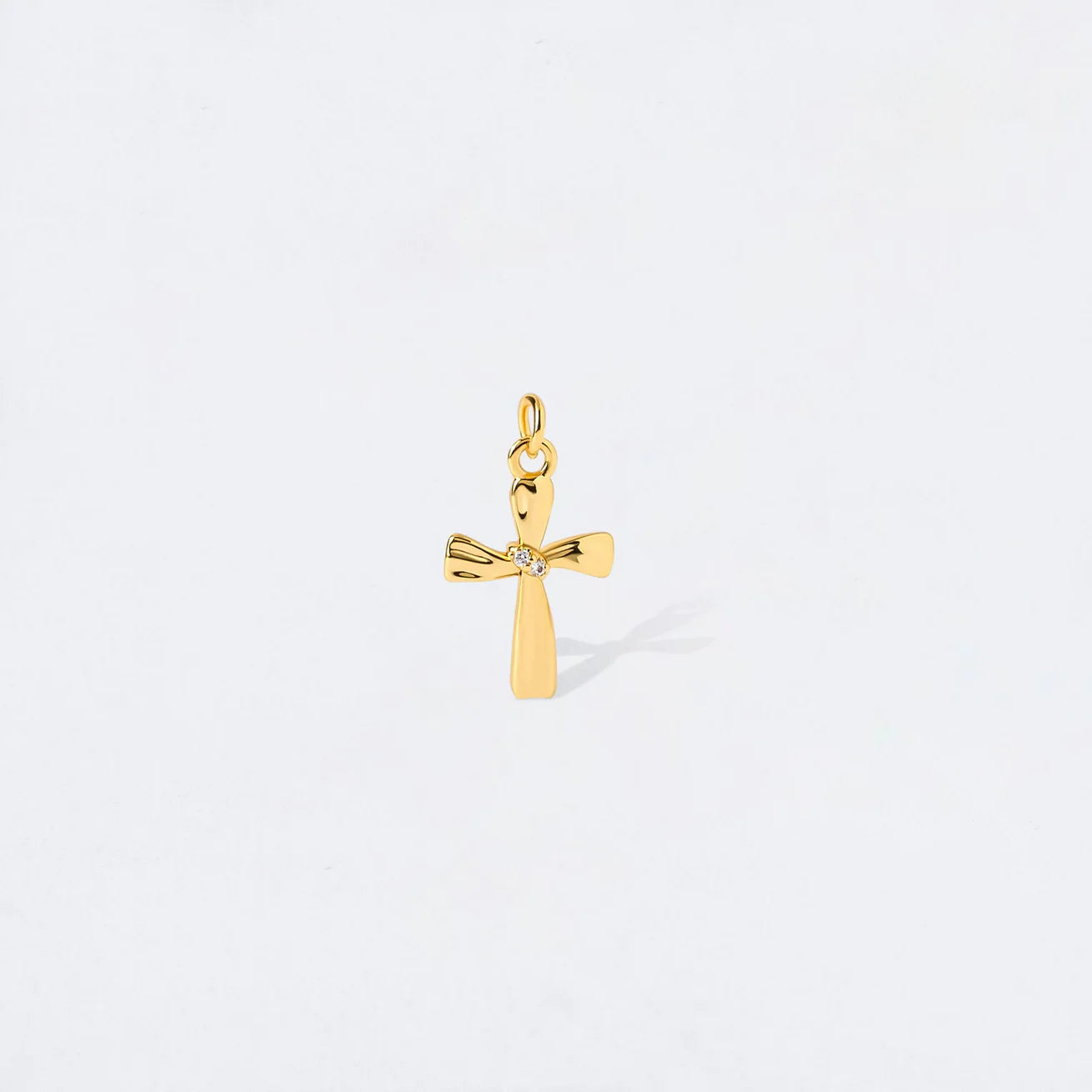 TWISTED CROSS CHARM PENDANT
